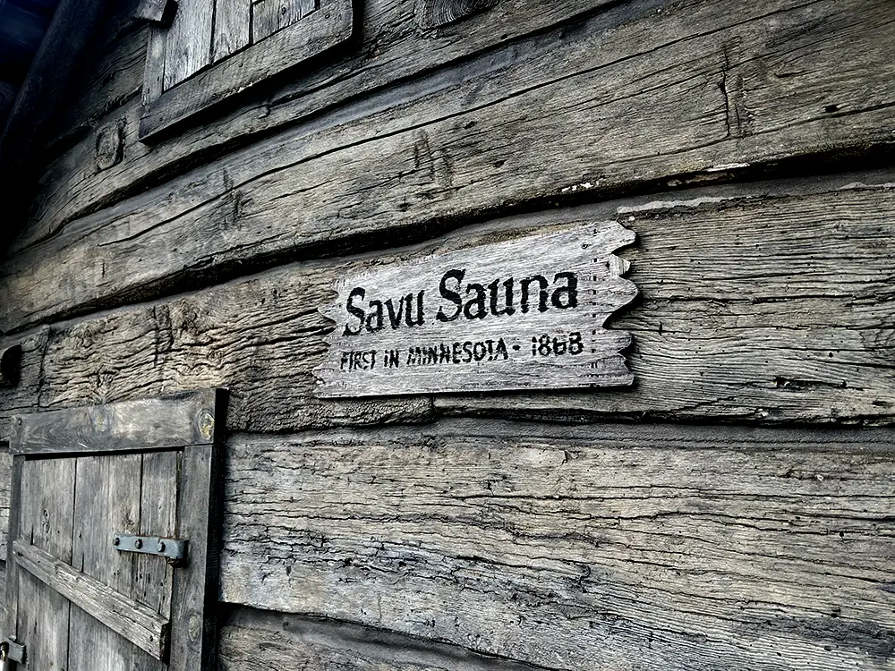 Photo shows close up of the savu sauna sign at it's current location in Cokato Minnesota