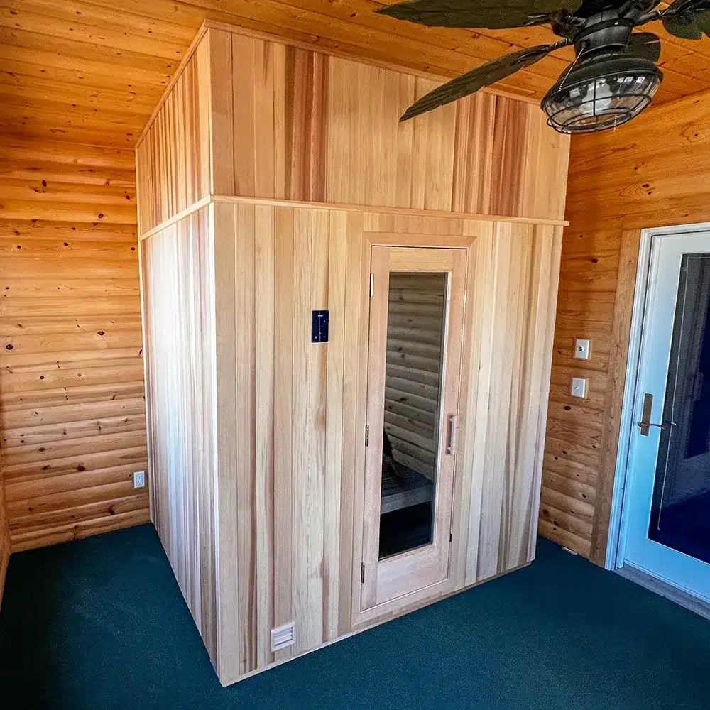 finnleo sisu sauna by sauna supply company - clear western red cedar with custom built false wall above