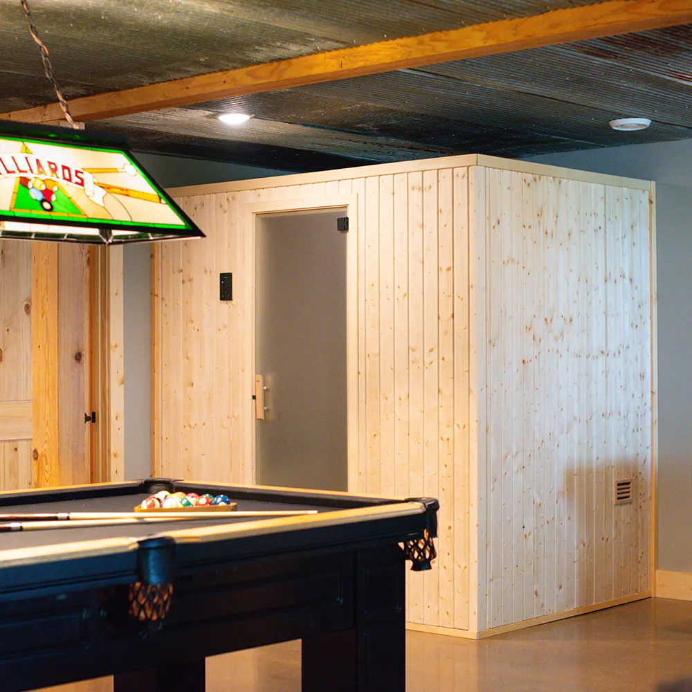 finnleo sisu sauna by sauna supply company in basement in front of a pool table