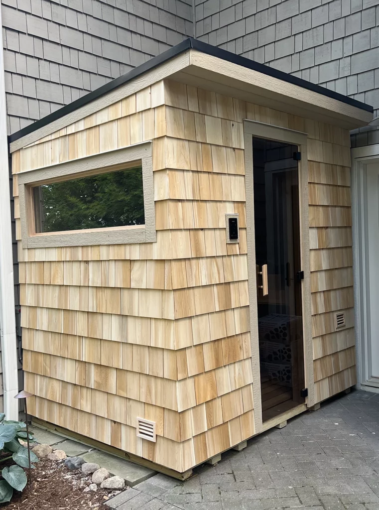 picture of a custom cedar shakes sauna we built