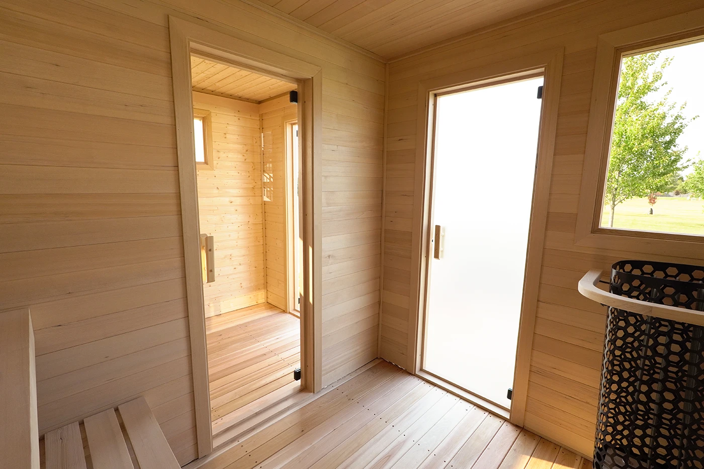 sauna clear glass door into changing room and satin frost door to the outside