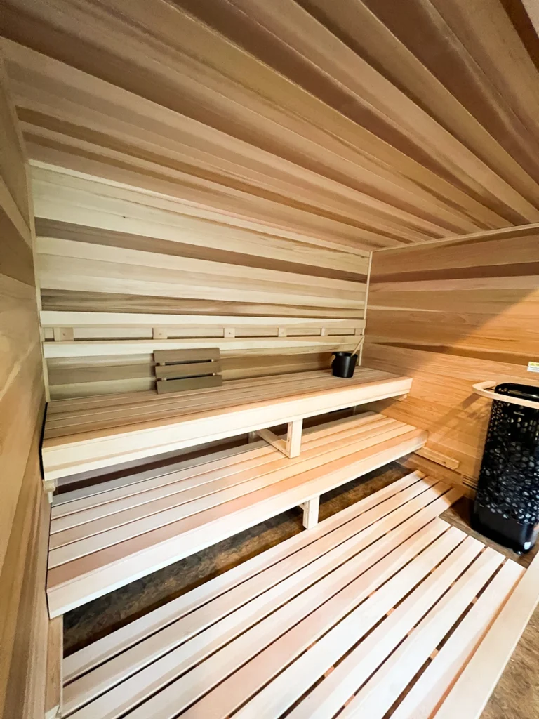 custom indoor cedar sauna with all glass front