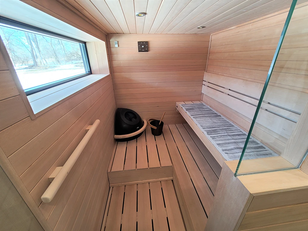 clear hemlock sauna with window and 3 bar wide backrest