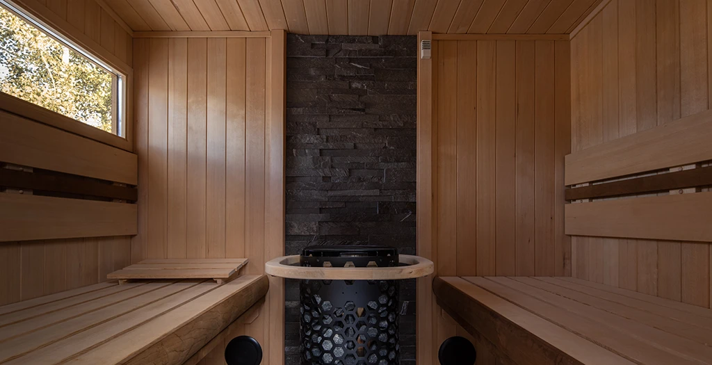 finnleo euro hemlock sauna with rock wall