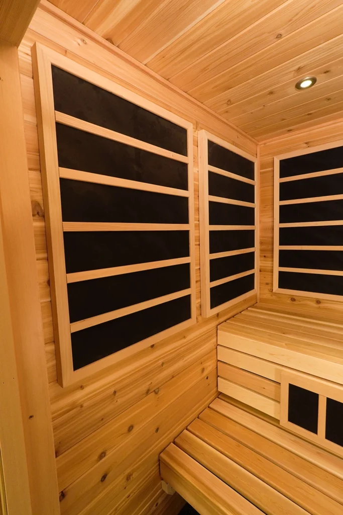 left wall infrared panels in hybrid sauna with knotty cedar