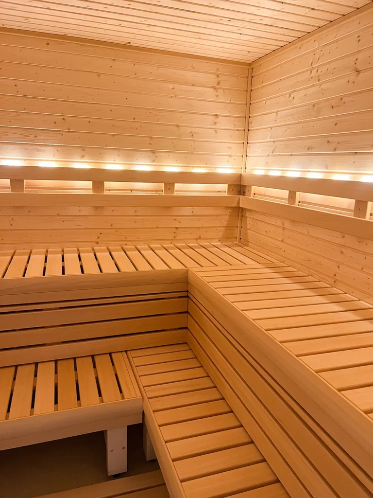 custom nordic spruce sauna with LED strip lighting and bench skirts