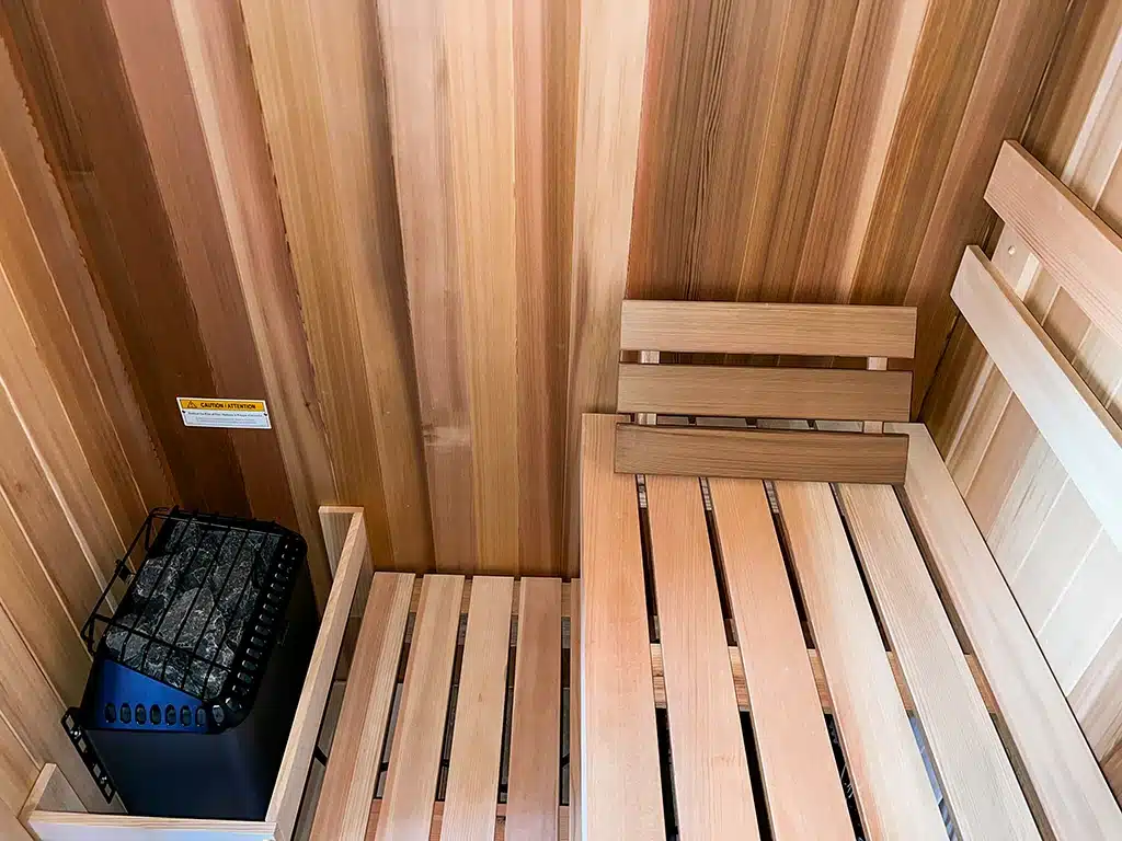 sisu cedar sauna interior with finnleo designer heater