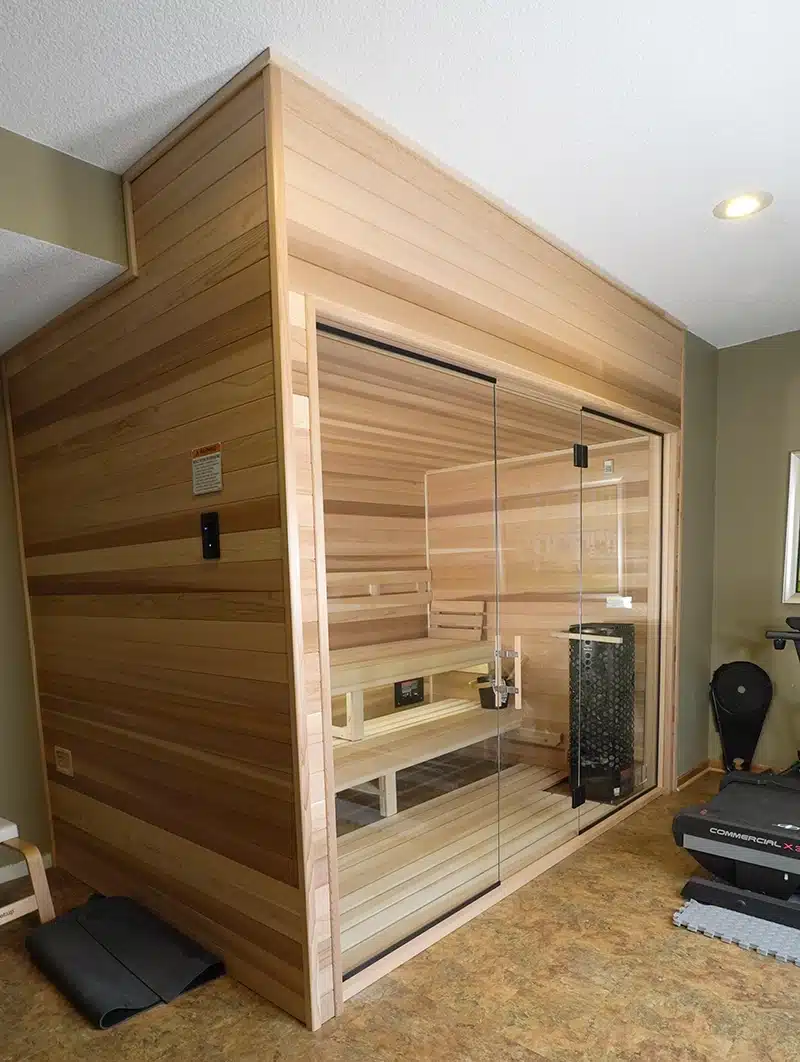 custom cedar sauna with traditional heater