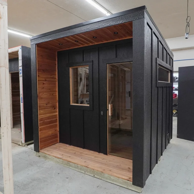 custom outdoor traditional wood-fired sauna with board & batten exterior
