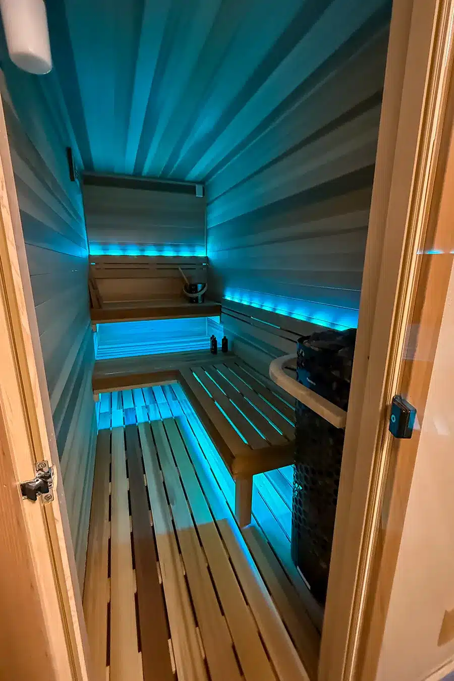 blue lighting in clear western red cedar converted from a closet