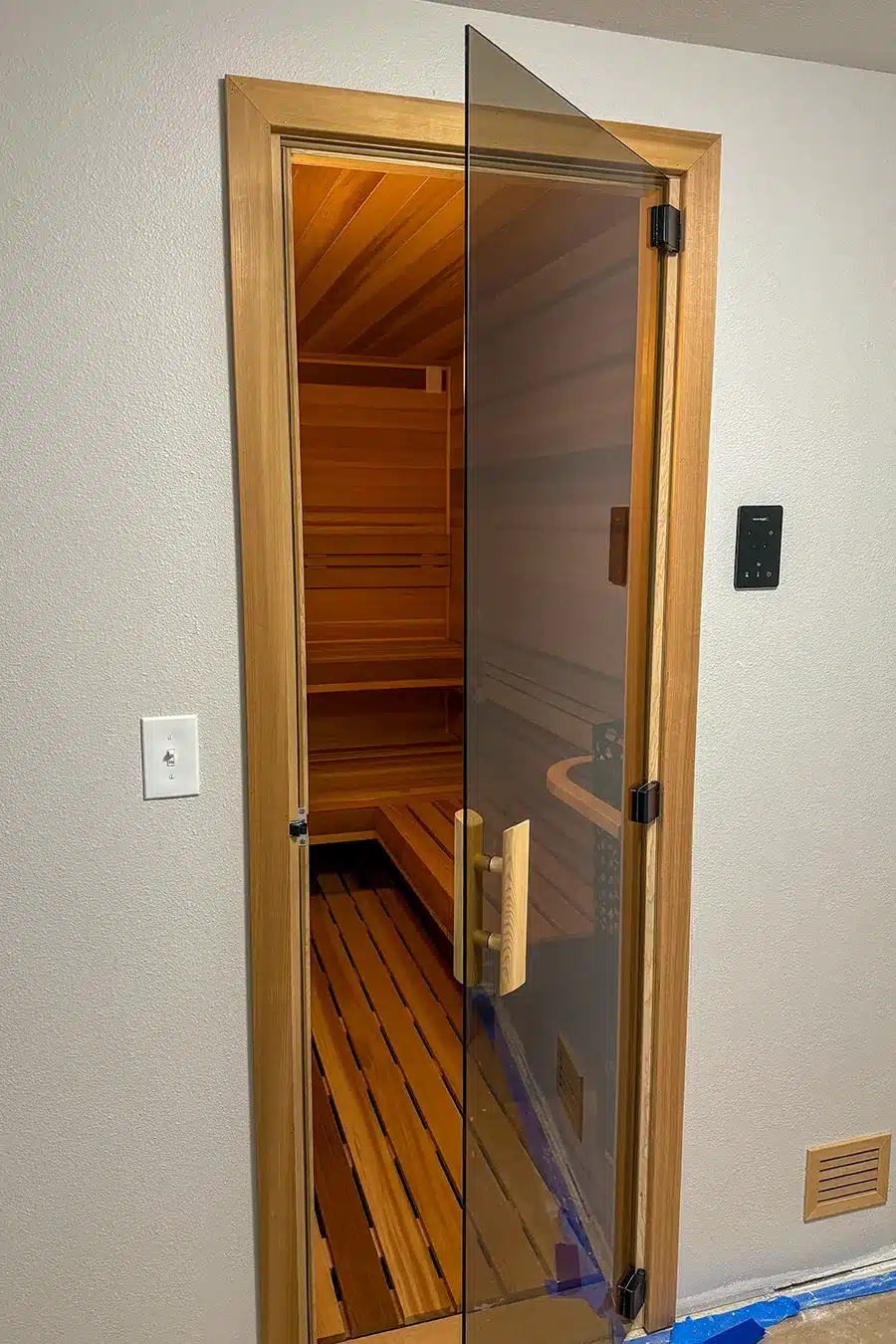bronze tint glass door on clear western red cedar converted from a closet
