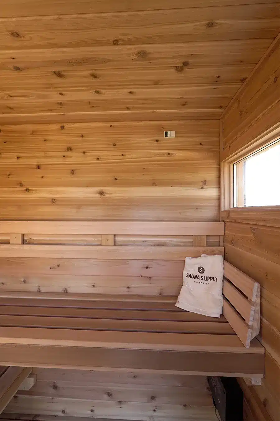 right bench in knotty cedar sauna