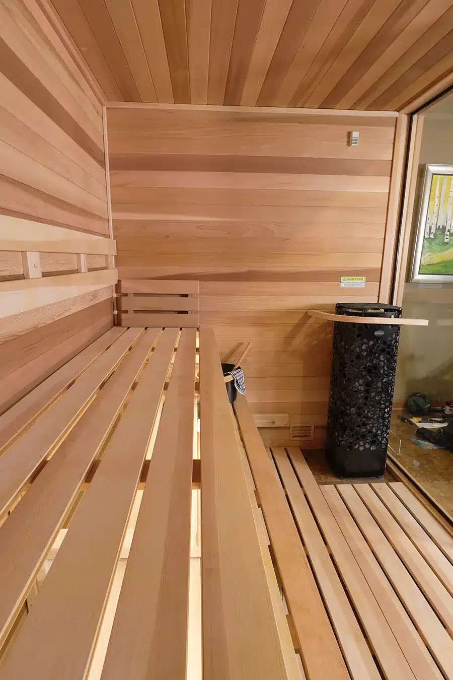 right wall in custom clear western red cedar with all glass front and saunum air equalizer
