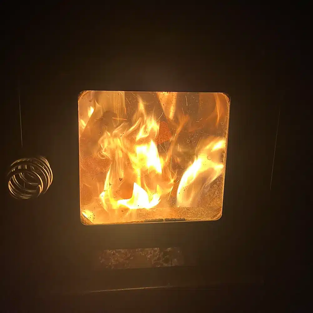 steam sauna co ssc 201 wood-fired stove with fire lit in sauna cokato mn