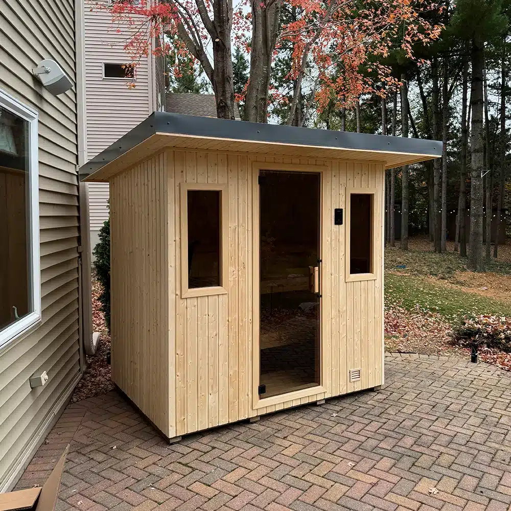 unstained finnleo northstar outdoor sauna on back patio installed by sauna supply company in minnesota