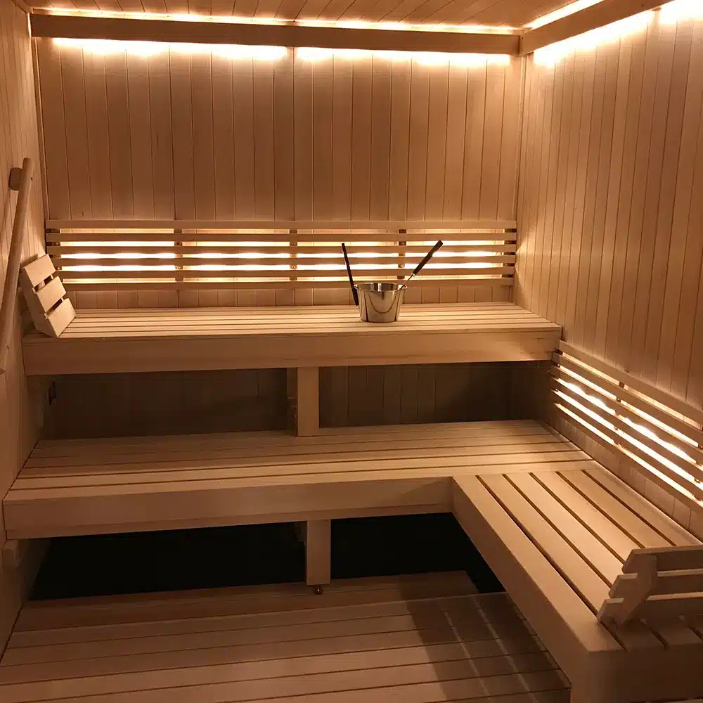 beautiful clear canadian hemlock sauna with valence lighting