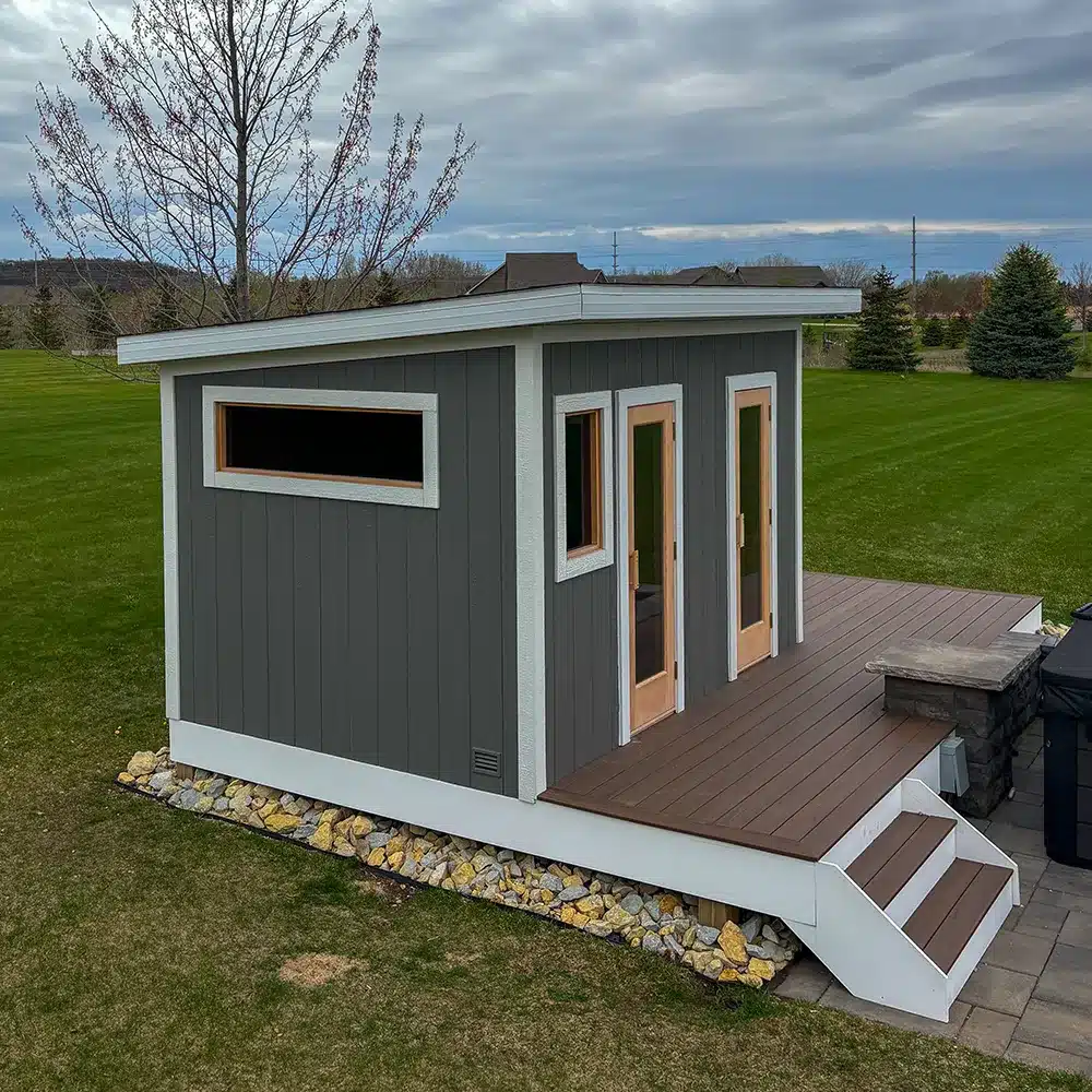 gray custom outdoor sauna with two doors on the front