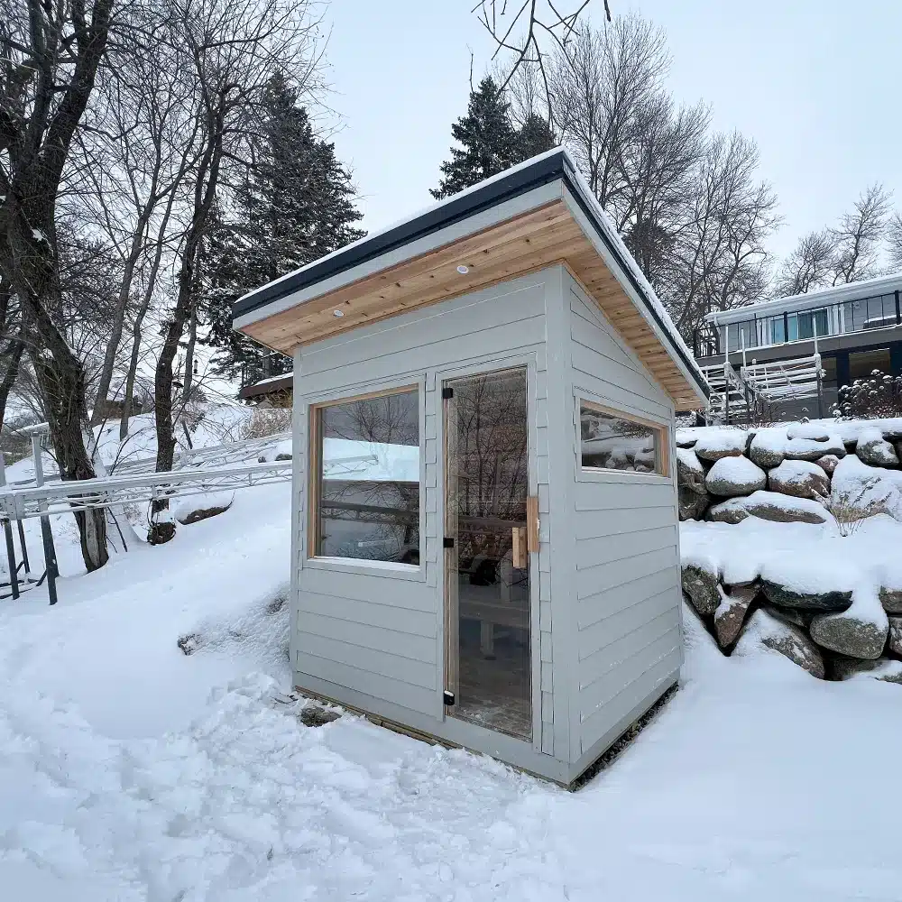 gray sauna with lap siding built on lake washington in minnesota