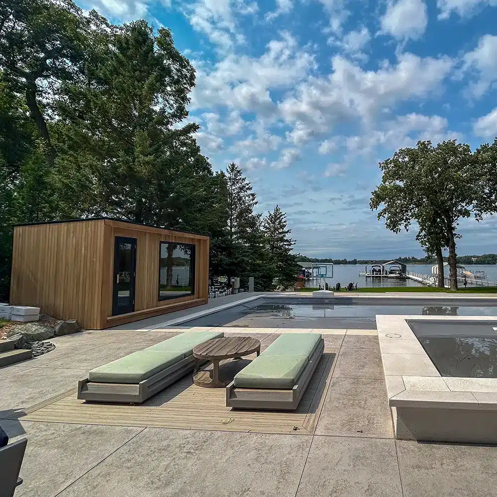 wide angle of custom thermo aspen outdoor sauna on the lake in minnesota