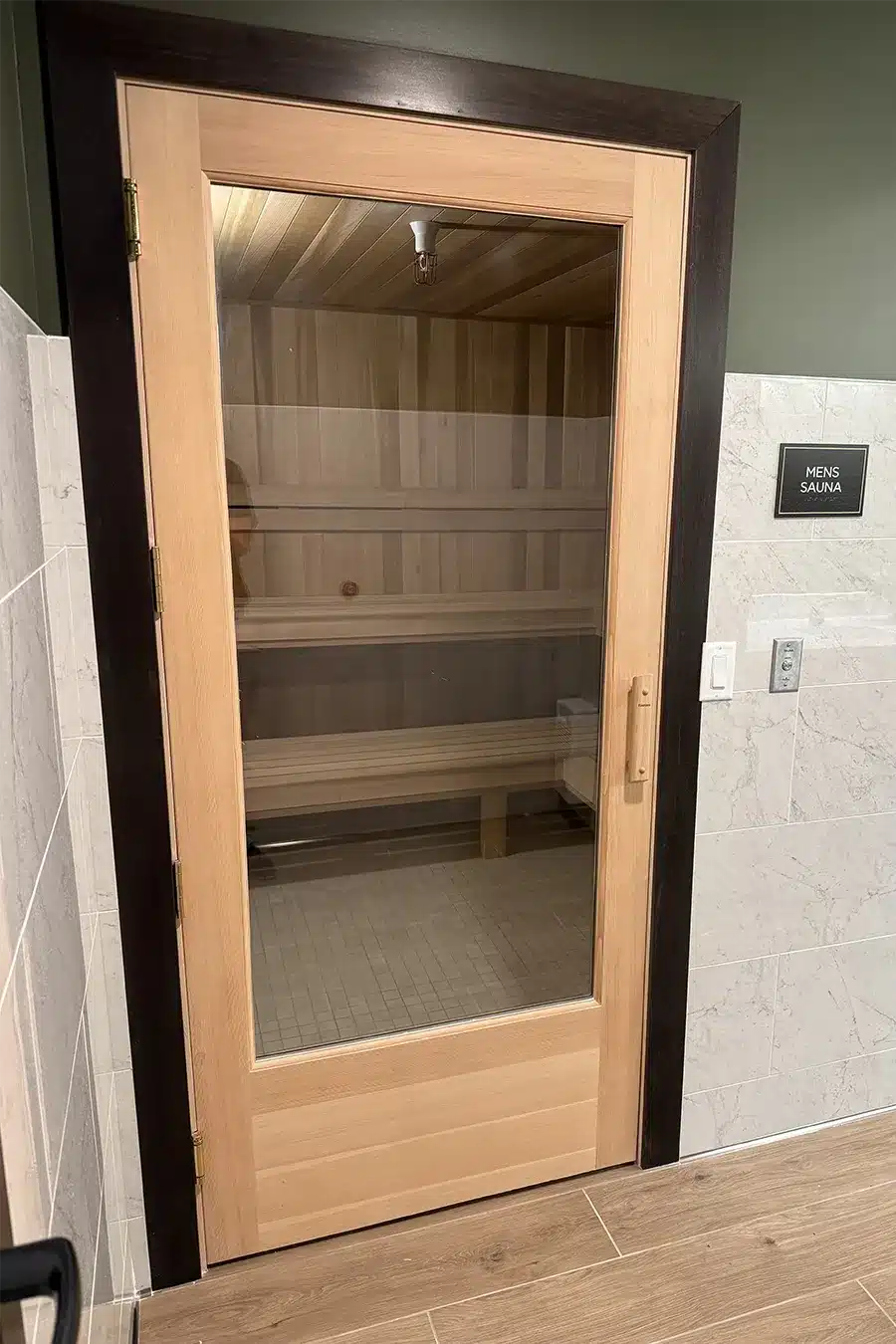ADA compliant douglas fir frame door on custom commercial sauna built in minnesota