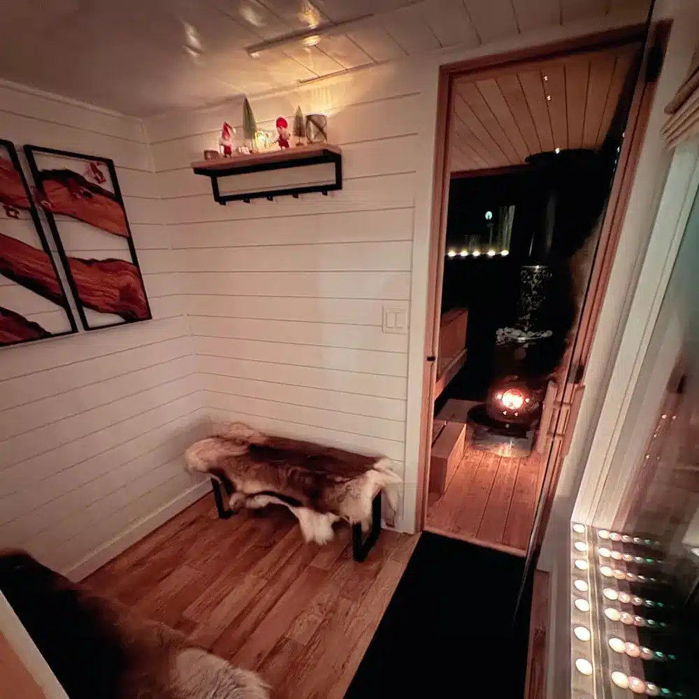 changing room in custom black taika outdoor sauna