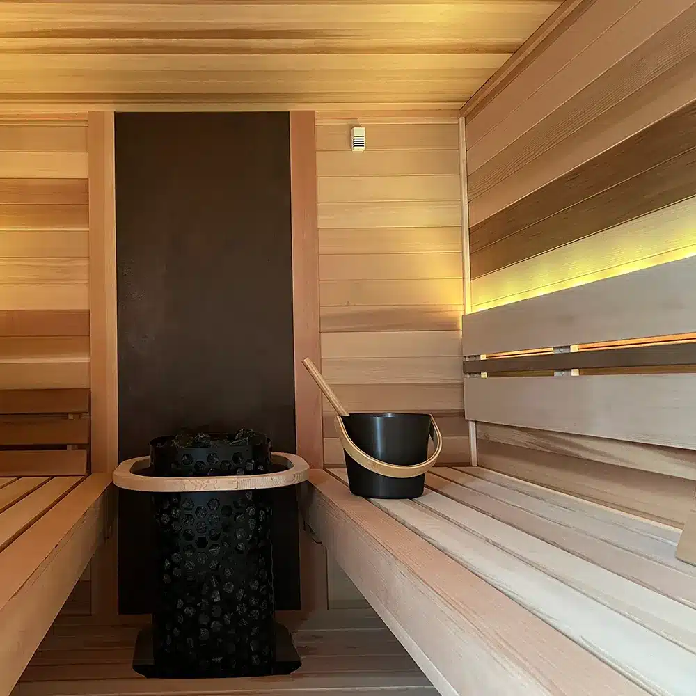 clear cedar benching and 3 bar wide ht backrest with led lighting in custom outdoor sauna