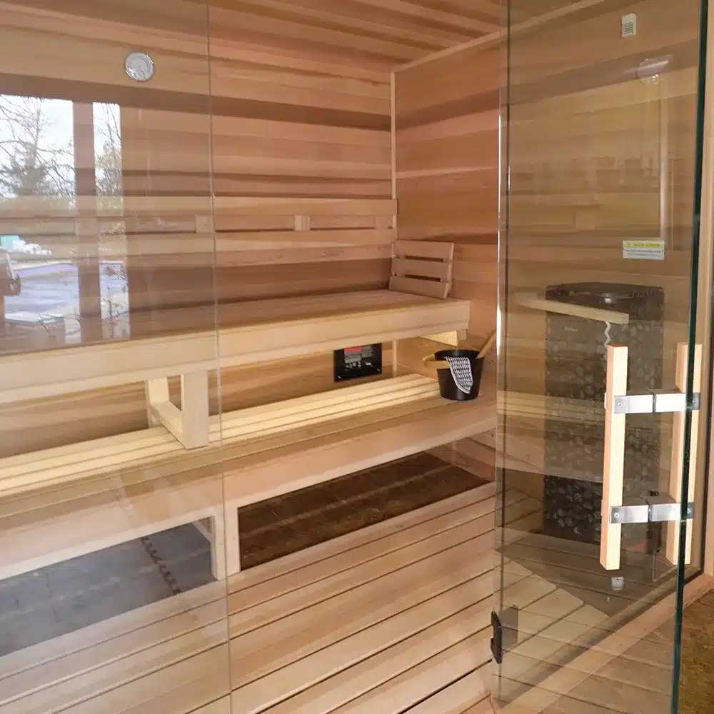 clear cedar indoor traditional sauna with 2 bar backrest and all glass front