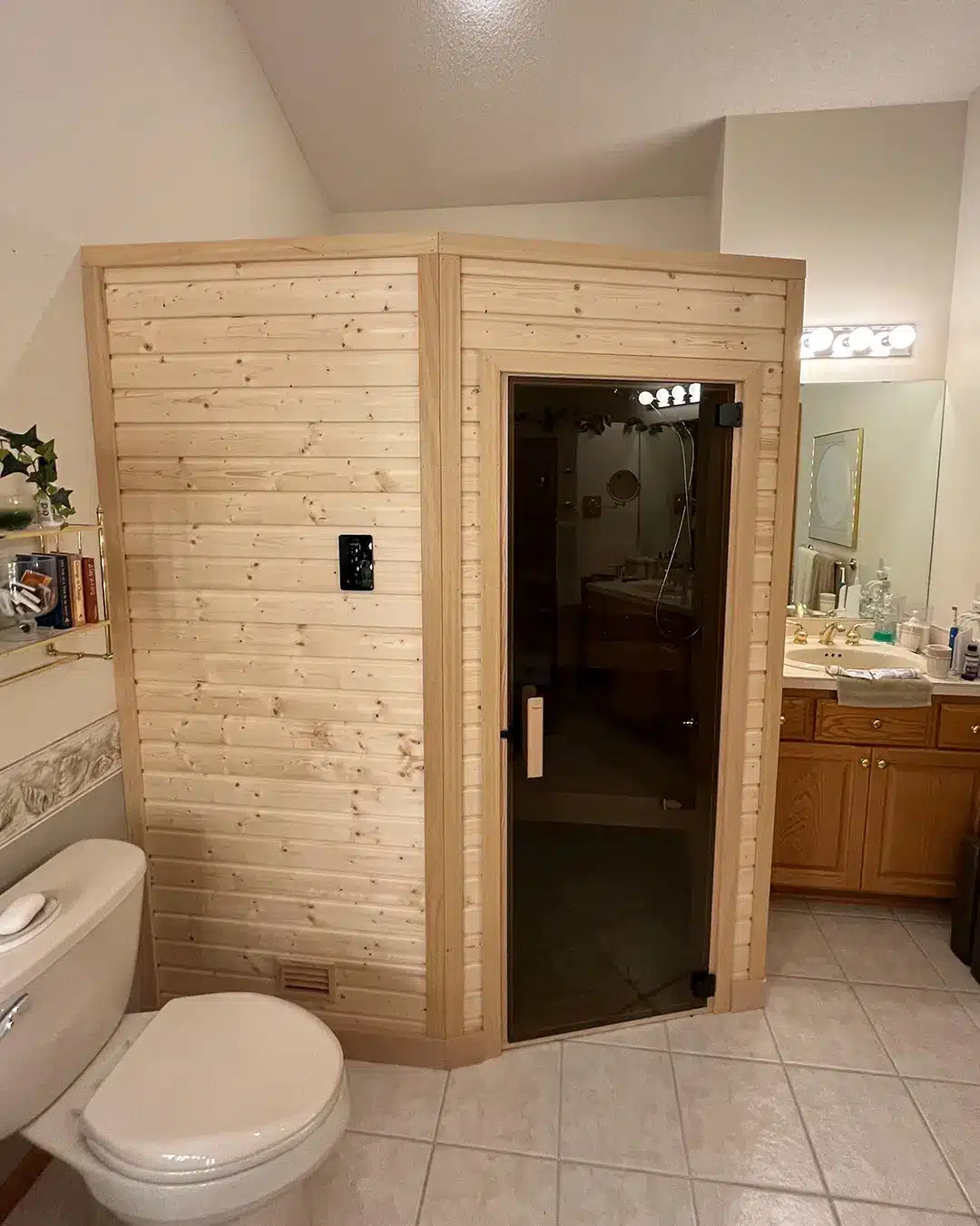 custom nordic spruce sauna in bathroom minneapolis, bronze tint door, custom corner design