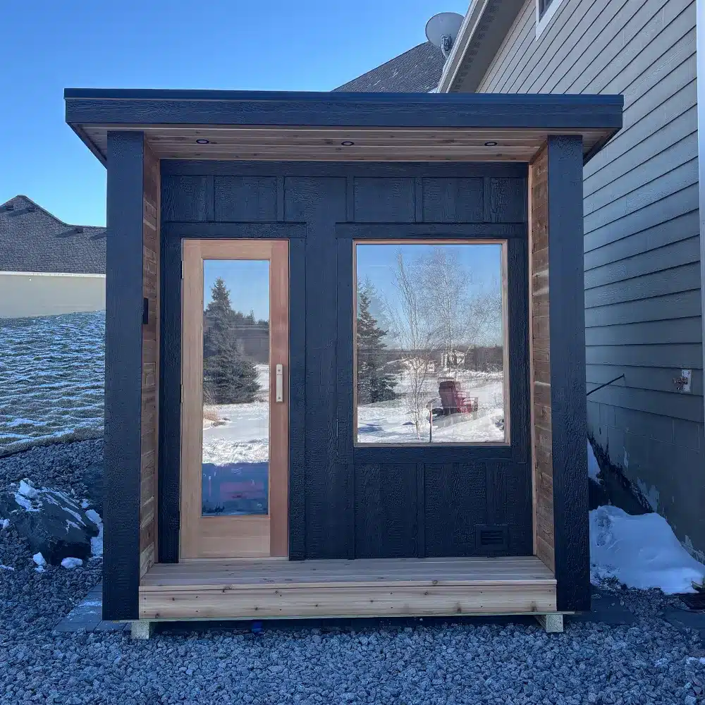 minnesota built custom outdoor 7x8 sauna with lp smartside exterior and board and batten with porch - front angle