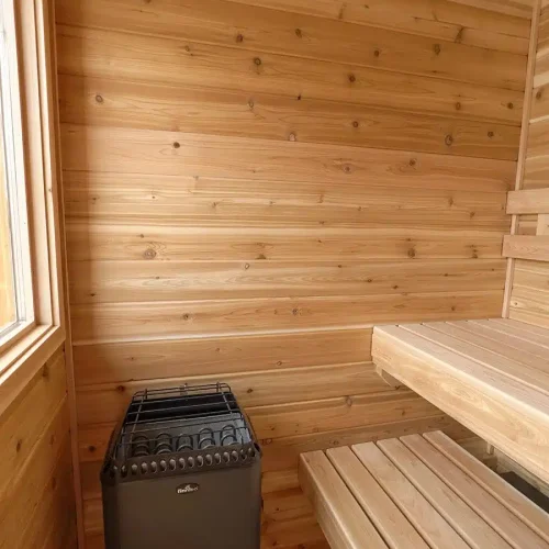 knotty cedar sauna with wall mounted finnleo designer heater.